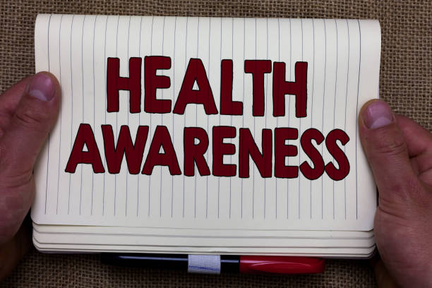 Handwriting text writing Health Awareness. Concept meaning Promoting community issues and preventative action Man hands holding notebook open page jute background Expressing ideas